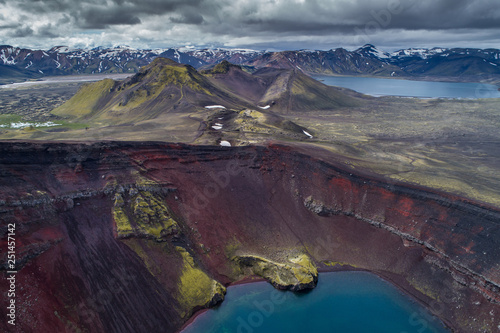 Iceland - Landmannalaugar - Aerial view of red lava rock volcano and crater lake in Volcano area Ljótipollur