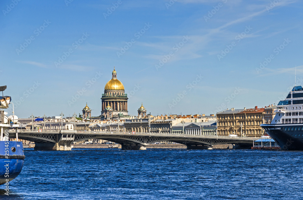 Saint Isaac's Cathedral behind the Blagoveshchenskiy bridge and Neva River with the cruise liner Azamara