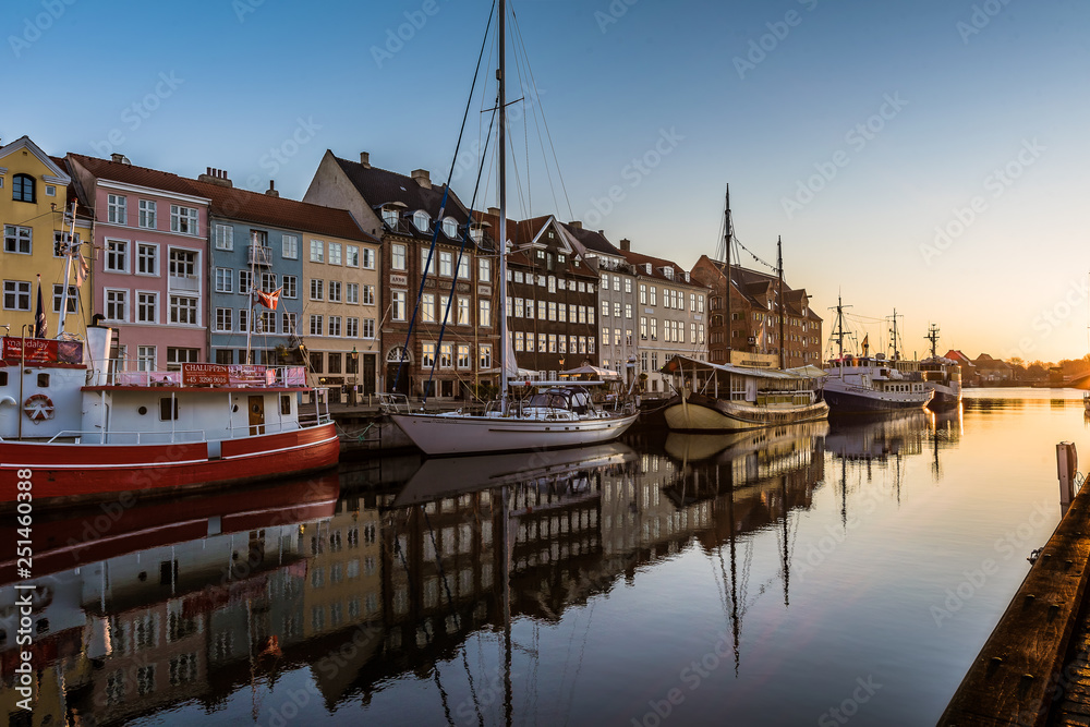 Colourful houses in the sunrise along the quay at Nyhavn Copenhagen