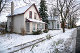 Detached Houses along an Icy Sidewalk in a Small Canadian Town on a Cold Winter Day