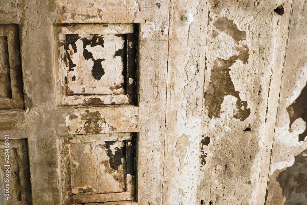 Cracked and peeling paint old wall background. Cracked old concrete vintage wall background,old wall. Natural light and texture