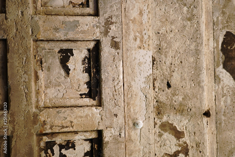 Cracked and peeling paint old wall background. Cracked old concrete vintage wall background,old wall. Natural light and texture