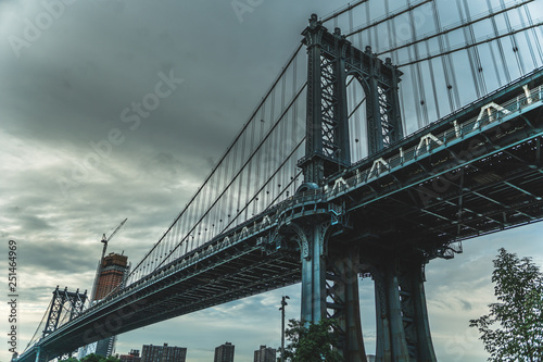 Manhattan bridge seeing from below with great sky in the background © Alejandro