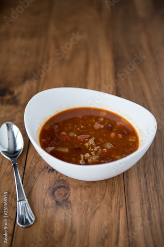 White bowl of chili with beans