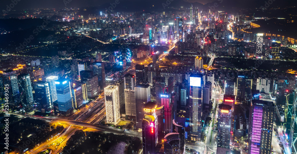 Obraz premium A bird's eye view of the urban architecture at night..