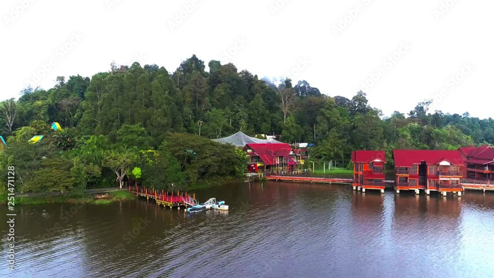 Aerial view of floating chalets on the Bukit Merah Lake Town Resort in Perak, Malaysia. Aerial view of floating chalets on the Bukit Merah Lake Town Resort in Perak, Malaysia.