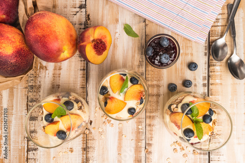 Granola with peaches  yogurt and blueberries