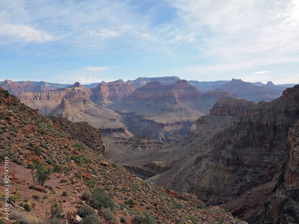 Obraz premium Sunrise and first light on the canyon walls on the Hermit Trail in Grand Canyon National Park, Arizona.