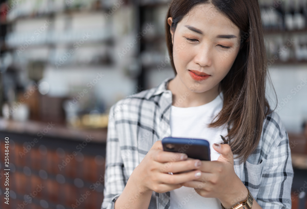happy woman using smartphone in cafe happy woman using smartphone in cafe