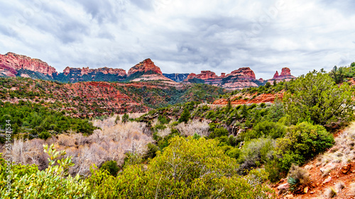 Rain clouds hanging over the red rocks of Schnebly Hill and other red rocks at the Oak Creek Canyon viewed from Midgely Bridge on Arizona SR89A, between Sedona and Flagstaff in northern Arizona, USA