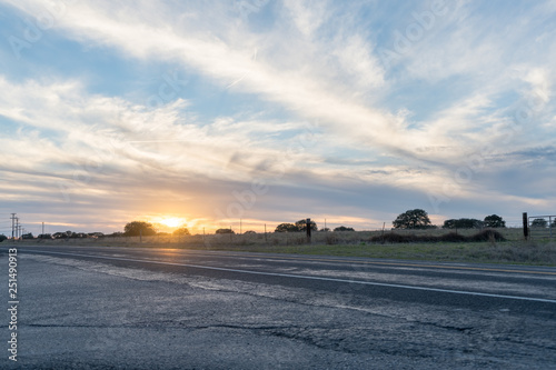 Low Angle View of Sunsetting on Open Texas Fields From the Highway photo