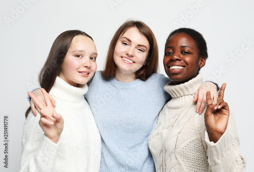   Cheerful European, Asian and African womens.