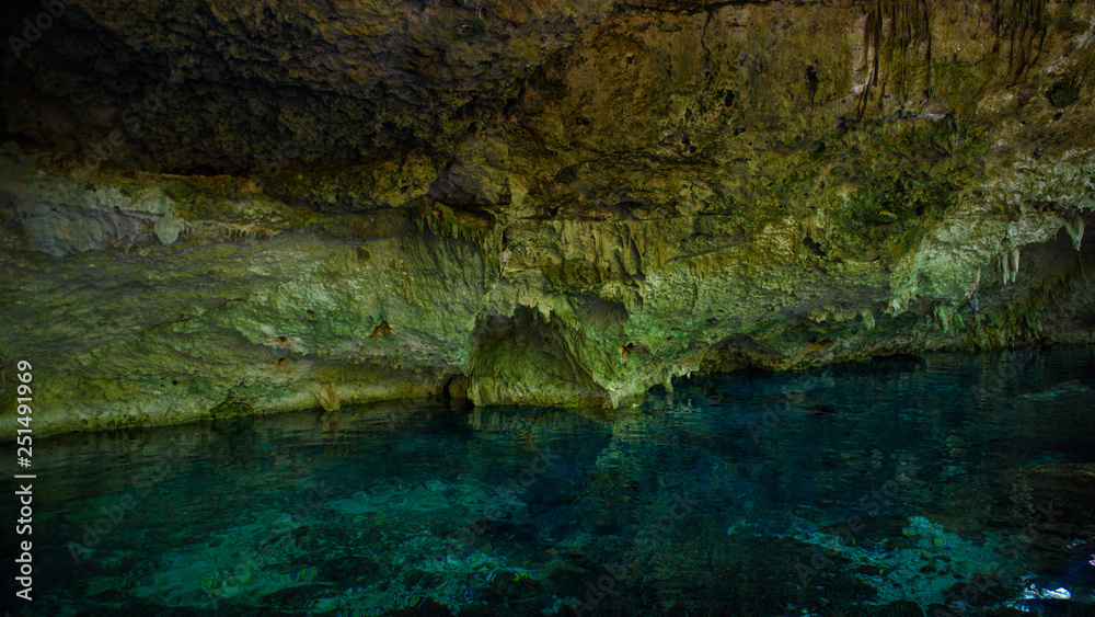 Cenote Dos Ojos with clear blue water Cenote Dos Ojos with clear blue water