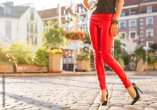 Woman in red leather trousers