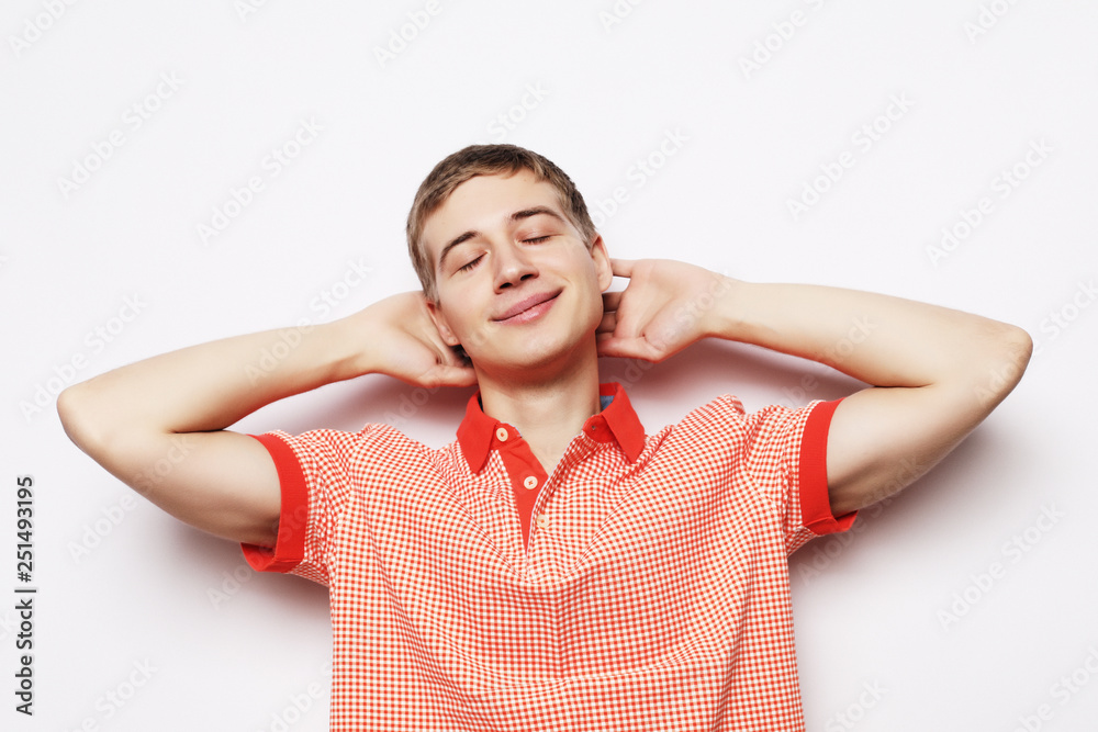 Portrait of a smart young man standing against white background Portrait of a smart young man standing against white background