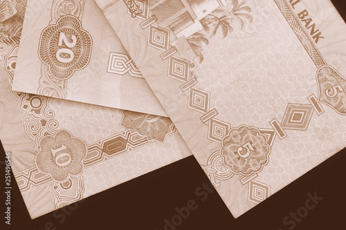 UAE dirham currency background close up. Brown color toned © Talulla