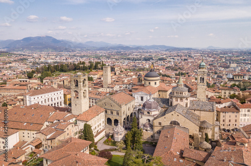 Bergamo, Italy. Drone aerial view of the old town. Landscape at the city center, its historical buildings, churches and towers © Matteo Ceruti