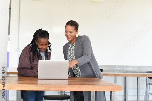 Two women collaborating on a project