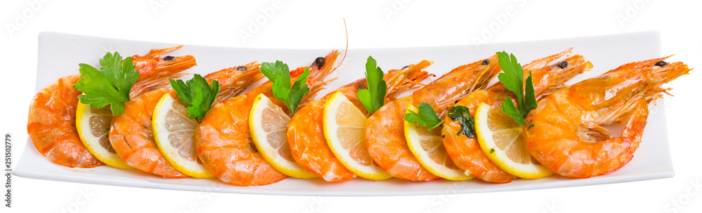 Appetizing fried shrimps with lemon and parsley