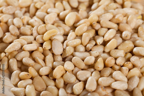 Heap pine nuts on wooden board