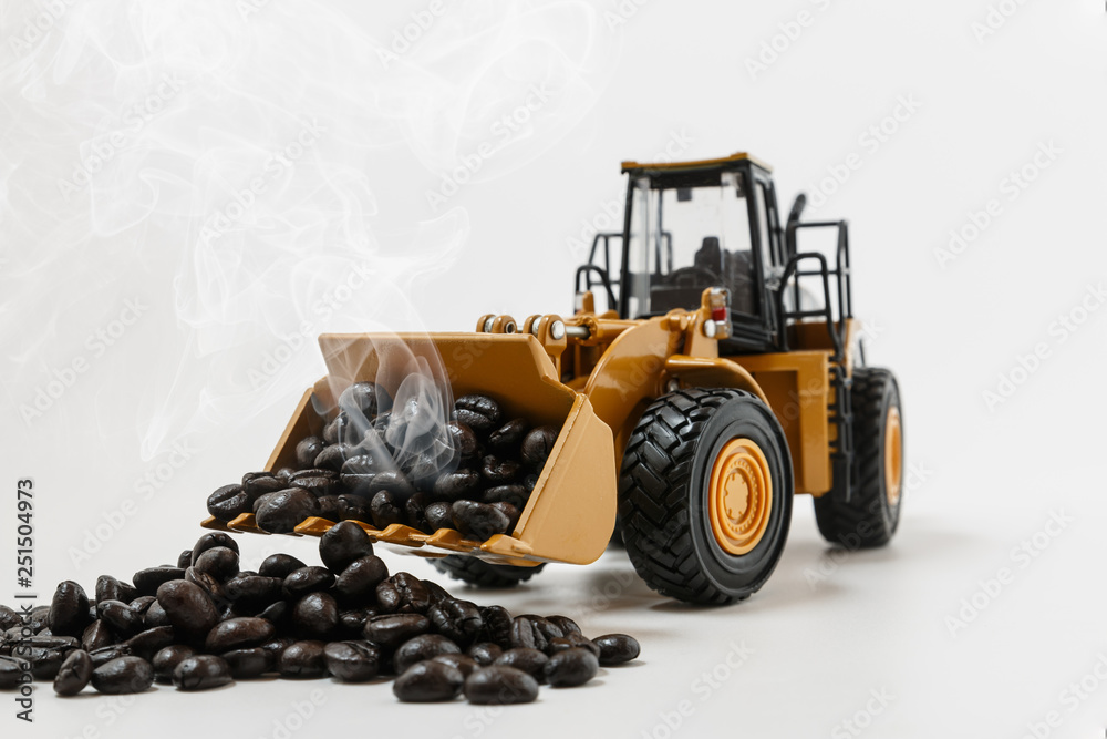 Roasted Coffee bean concept on scoop bucket of Wheel loaders model Roasted Coffee bean concept on scoop bucket of Wheel loaders model