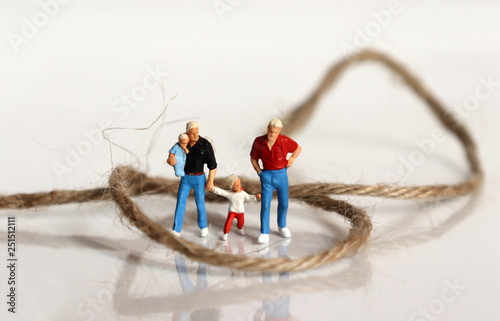 Fotografie Miniature people and miniature glasses