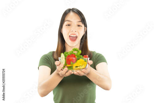 Happy lady enjoy eating vegetable salad over white copy space background - people with organic healthy food concept