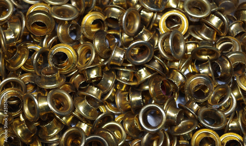 Eyelets (small grommets) for reinforcing punched holes in thick paper or cardboard