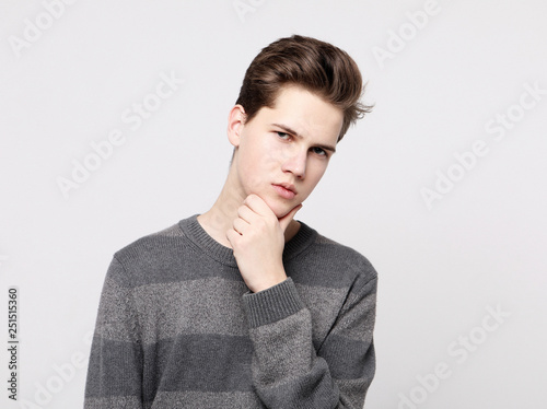 Attractive teenage boy posing in studio