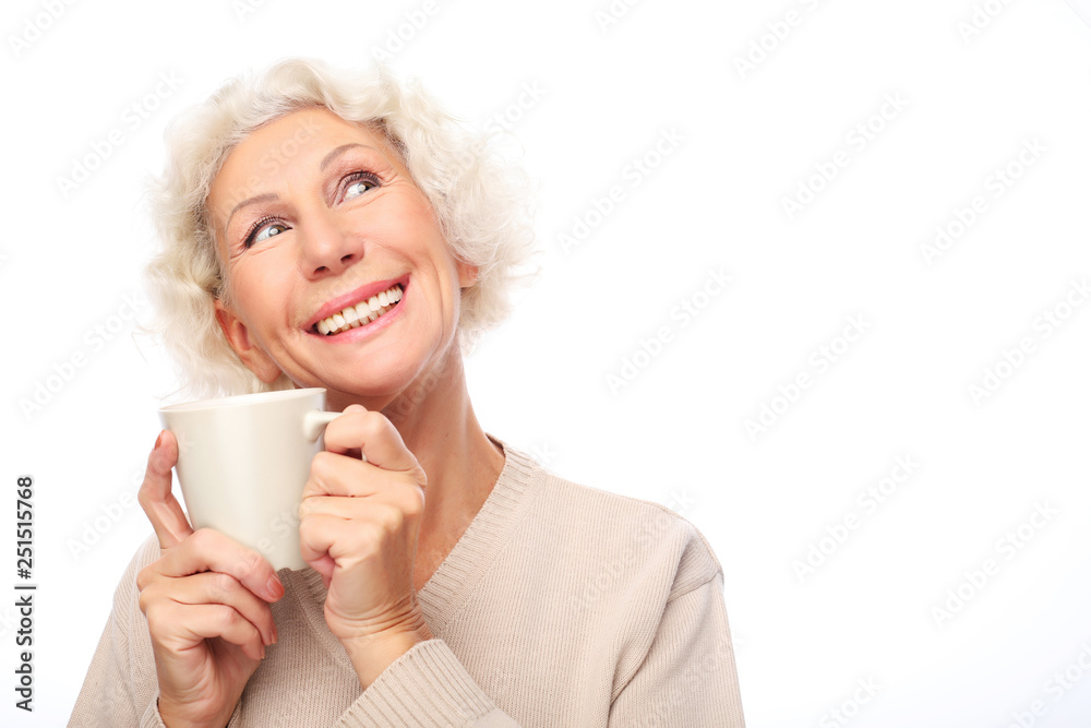 old excited lady smiling laughing, holding cup drinking coffee or tea old excited lady smiling laughing, holding cup drinking coffee or tea