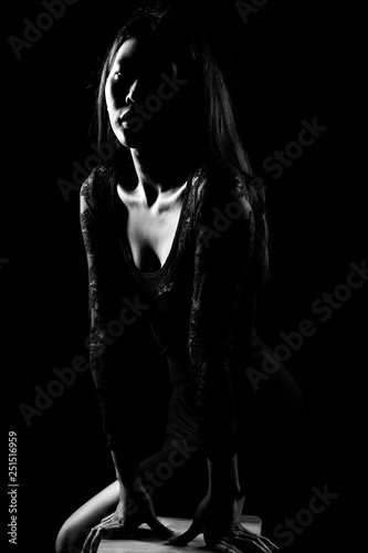 Silhouette Slim Skin Asian Woman black straight hair with Body Suit rim light, Abstract high low key exposure contrast, copy space for text logo, broken heart lonely girl can cry