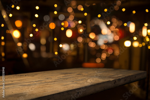 Beer barrel with beer glasses on a wooden table. The dark brown background.