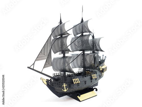 Gold and Black Color Ship Classic Model with Pirate Flag Symbol in White Isolated Background