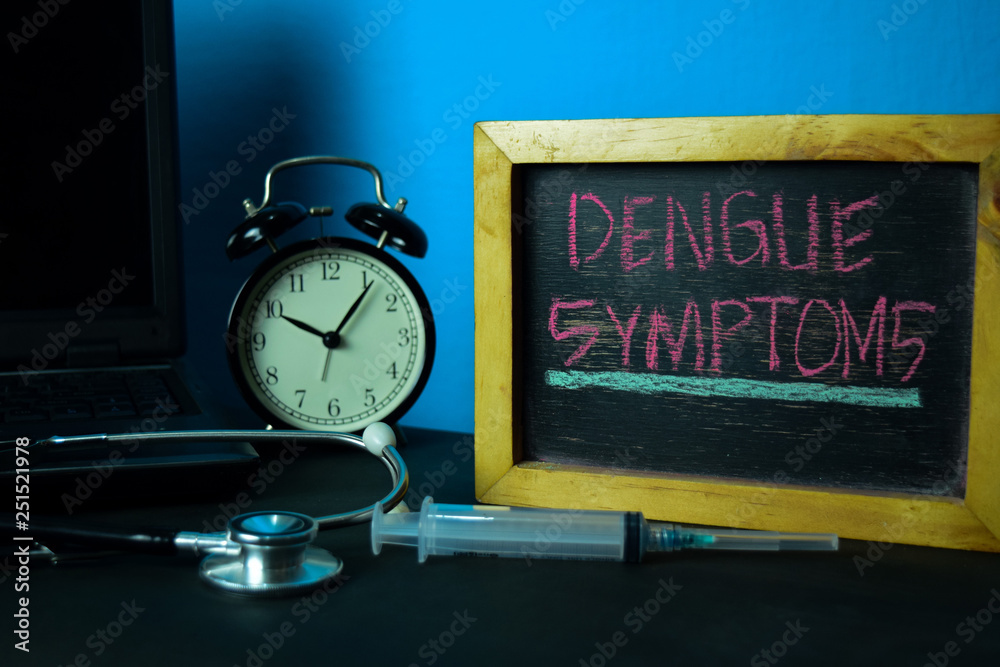 Dengue Symptoms Planning on Background of Working Table with Office Supplies. Medical and Healthcare Concept Planning on Blue Background Dengue Symptoms Planning on Background of Working Table with Office Supplies. Medical and Healthcare Concept Planning on Blue Background