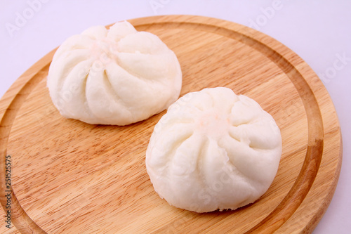 Steamed buns on the wooden floor.