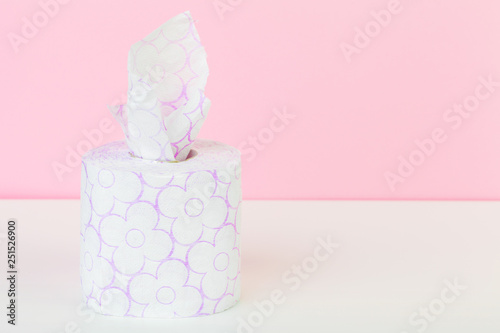 Roll of toilet paper or tissue on color background
