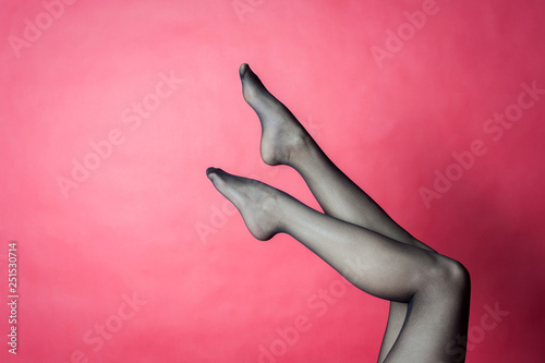 Legs of young caucasian woman in black tights