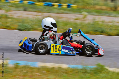 Young go cart racer on circuit © Mark_studio