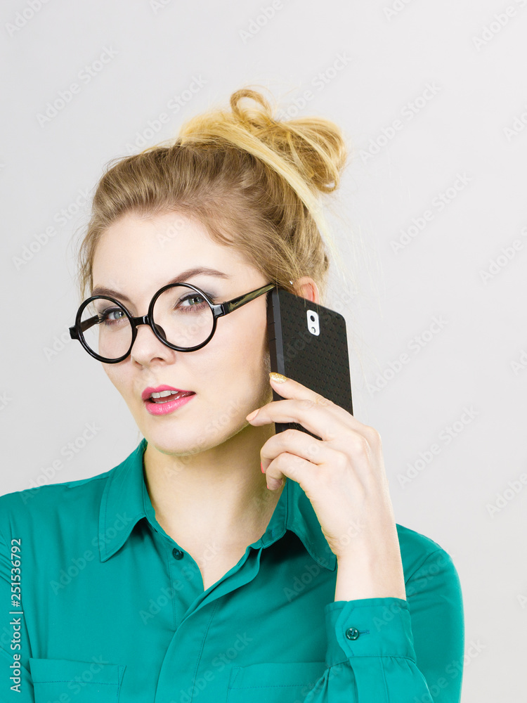 Focused business woman talking on phone