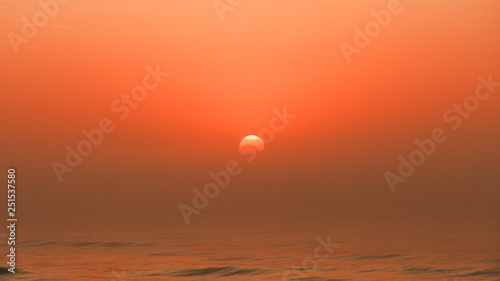 Beatiful red sunset over sea surface