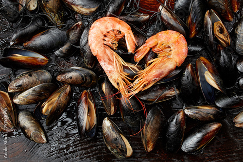 Shrimp in the shape of a heart on the background of mussels