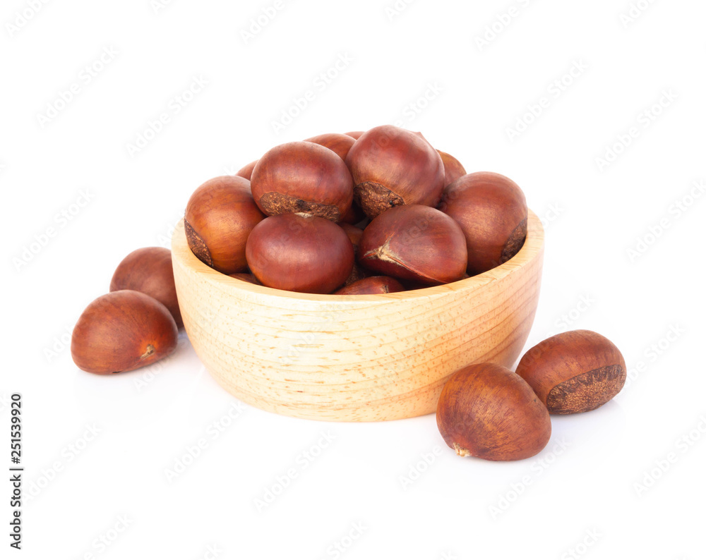 Closeup horse chestnuts in wood bowl isolated on white background, healthy food concept Closeup horse chestnuts in wood bowl isolated on white background, healthy food concept