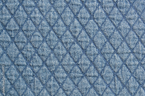 Quilted fabric blue denim cloth element texture close up background