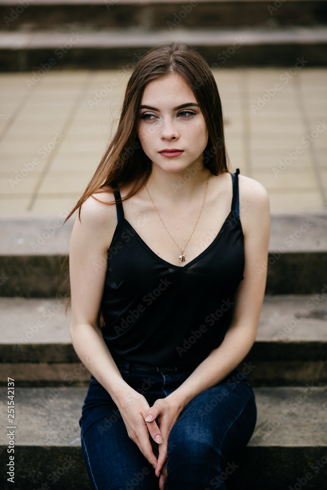 Fototapeta premium young girl posing on a street in the city