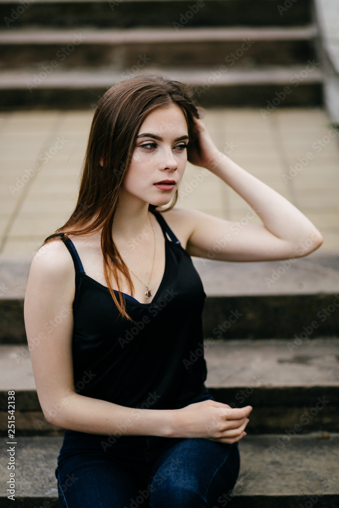 Fototapeta premium young girl posing on a street in the city