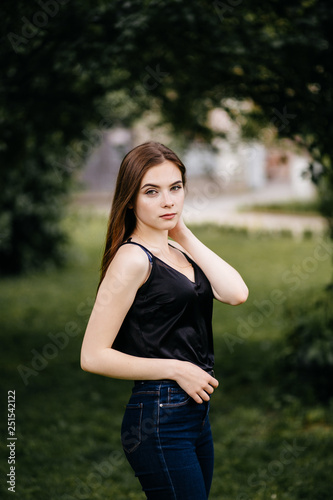 young girl posing on a street in the city