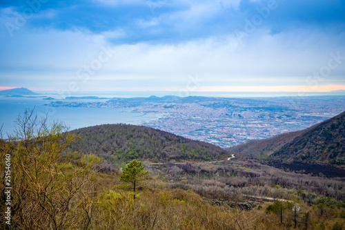 View from active volcano Vesuvius on the Gulf and Naples city in evening, Italy