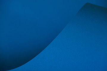 Abstraction of a design blue paper. Empty space on monochrome paper.