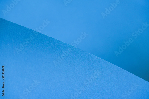 Abstraction of a design blue paper. Empty space on monochrome paper.