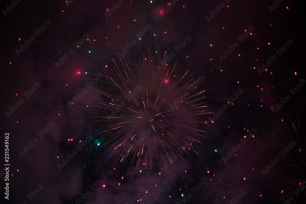 Fototapeta premium Explosive and colorful holiday fireworks at night sky.